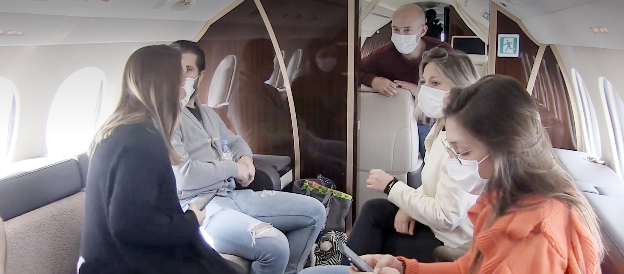 Volunteers aboard a Dassault Falcon 8X