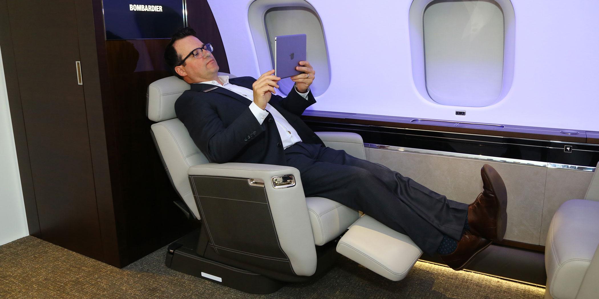 Tim Fagan, Bombardier manager of industrial design, in the Nuage seat Photo: David McIntosh