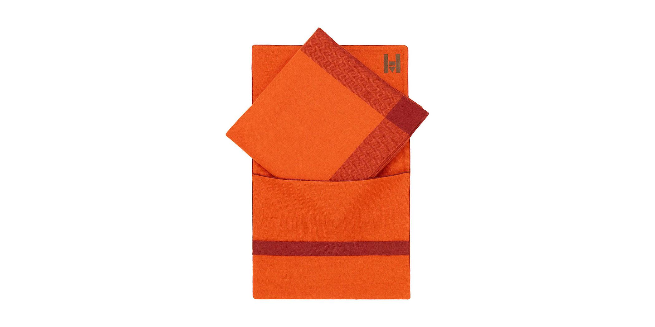 A hand-woven 100 percent cashmere travel blanket and case from Hermès