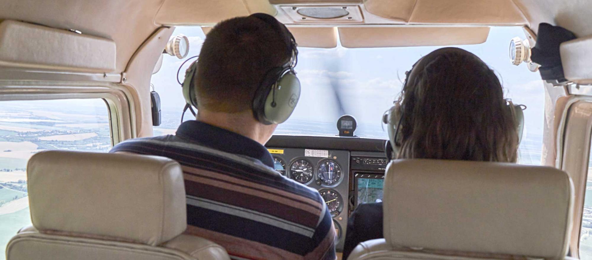 pic of two people in cockpit