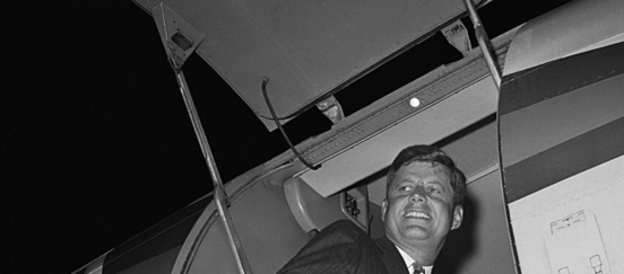 President-elect John F. Kennedy enters his airplane in 1960