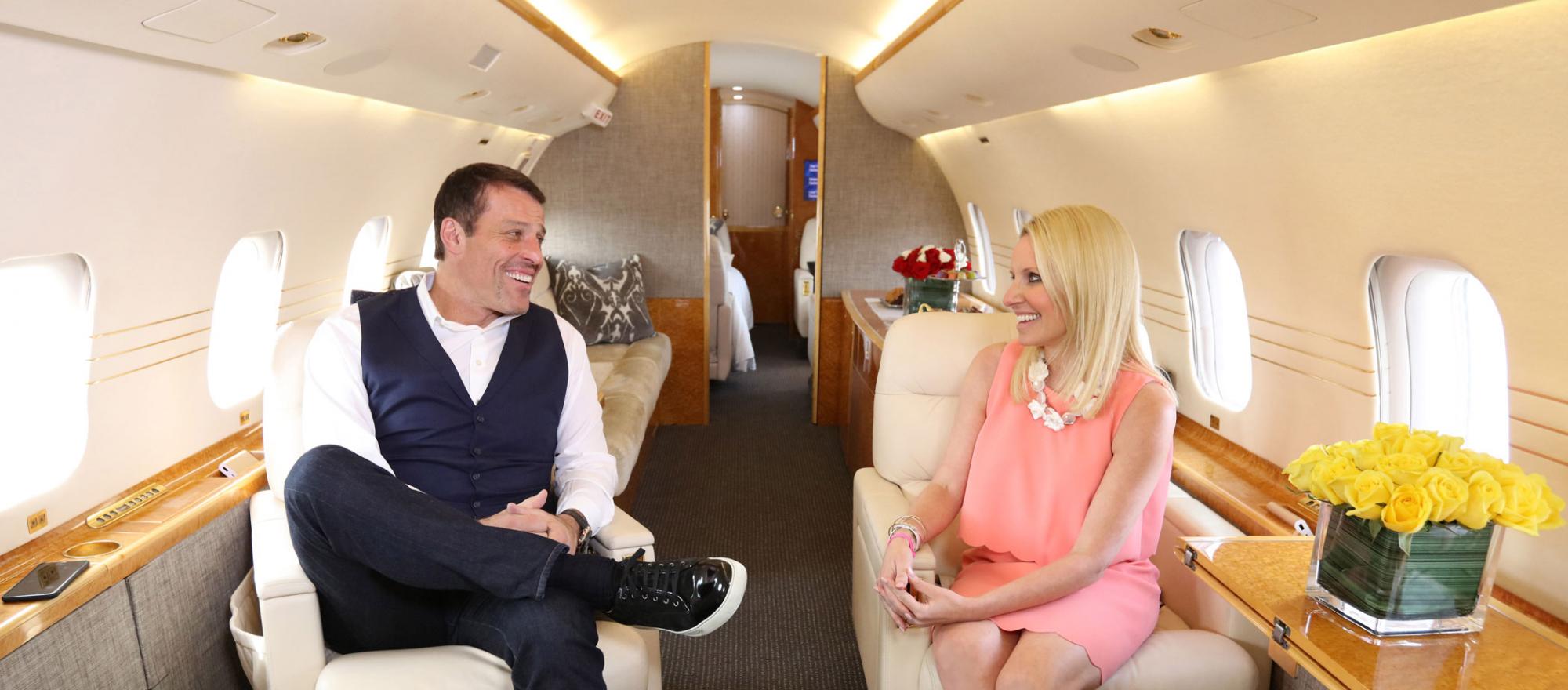 Tony Robbins talks with Jennifer Leach English aboard his new jet. Photo: Cy Cyr