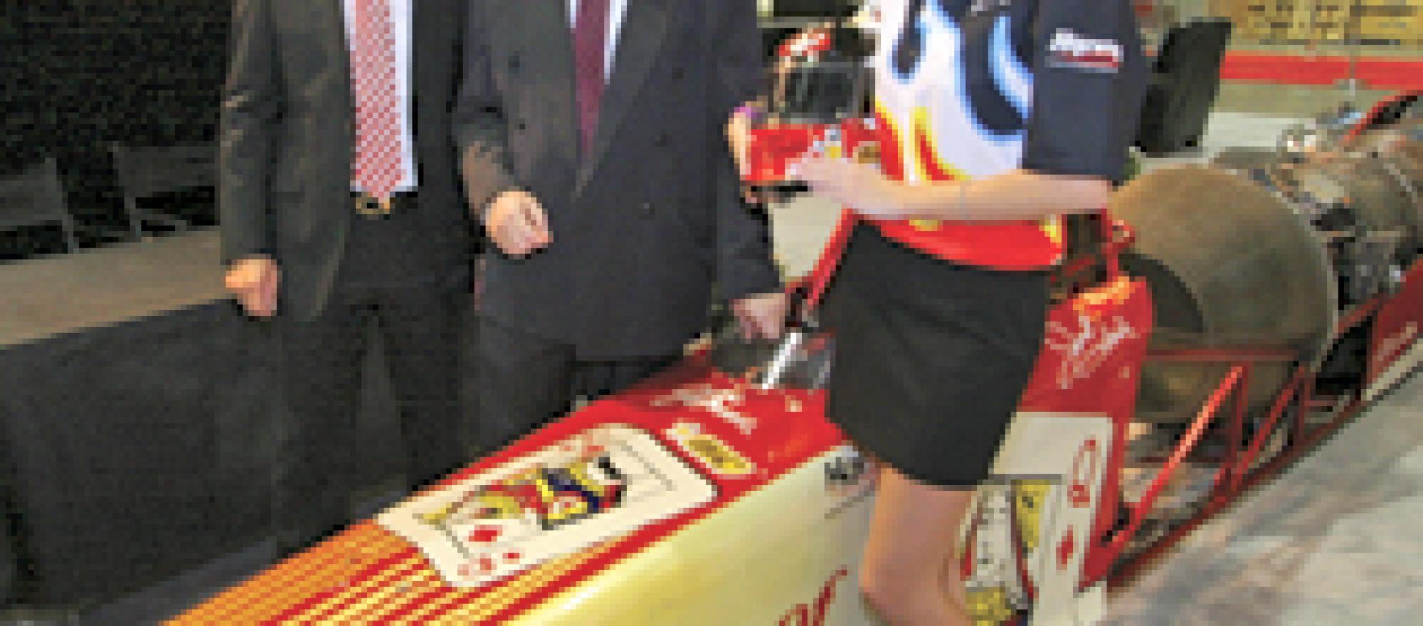 Race car driver Jesse Harris with BizJet International’s Bern Kowalewski and,