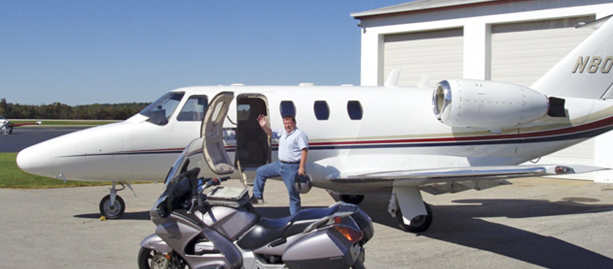 Ride and Fly president John Garwood with a Beechjet charter and his own road 
