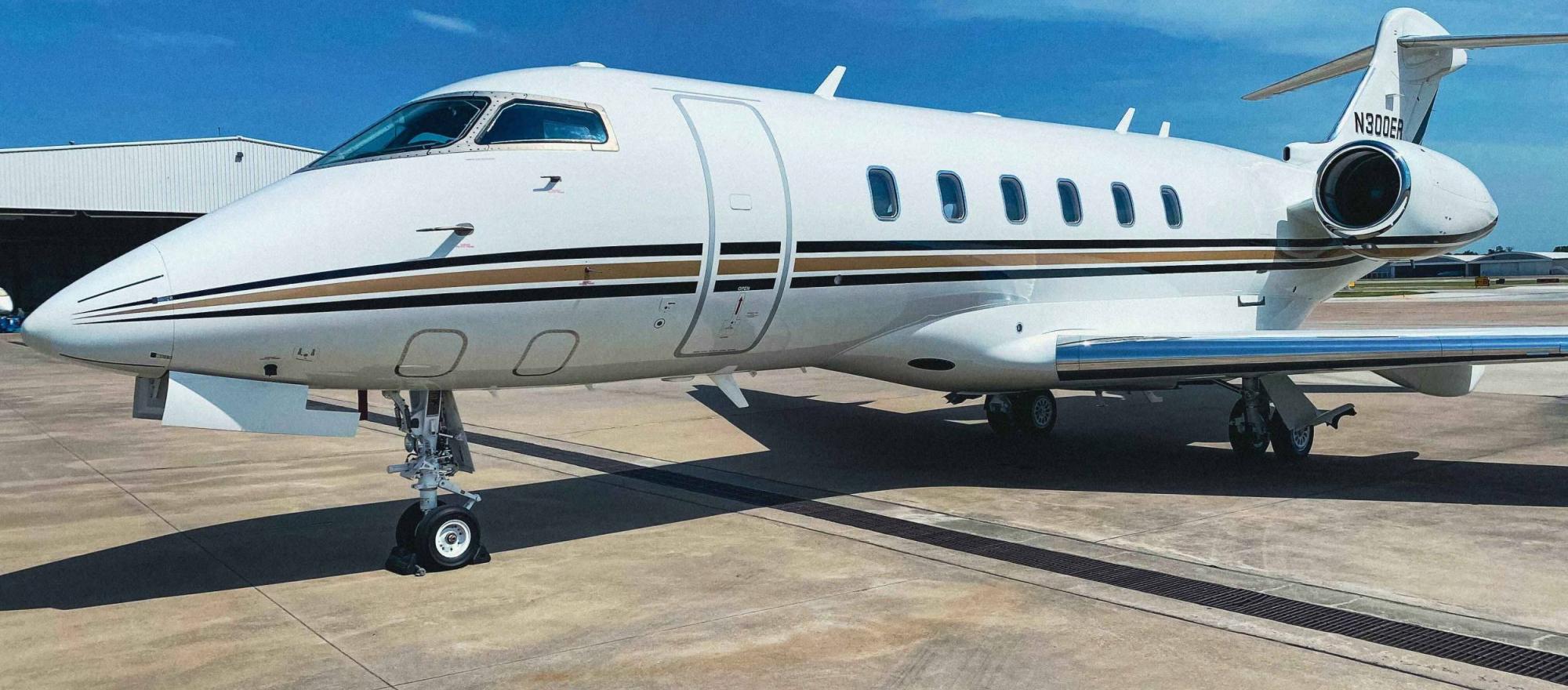 Bombardier Challenger 300 registered as N300ER on airport ramp 