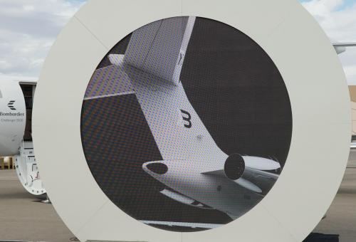Video screen showing rendering of Bond livery on tail of Bombardier Global aircraft