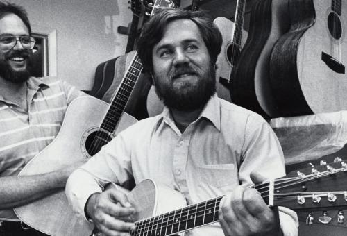 Bob Taylor (left) and Kurt Listug, shown here in 1985, launched their guitar-building business more than 40 years ago.
