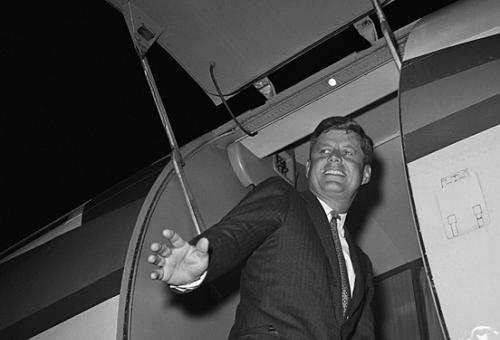 President-elect John F. Kennedy enters his airplane in 1960