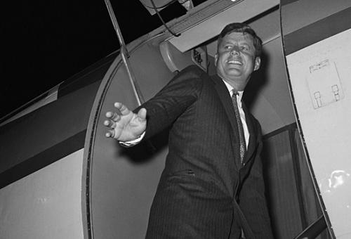 President-elect John F. Kennedy enters his airplane, the Caroline, at Palm Be