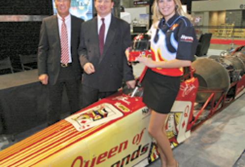 Race car driver Jesse Harris with BizJet International’s Bern Kowalewski and,