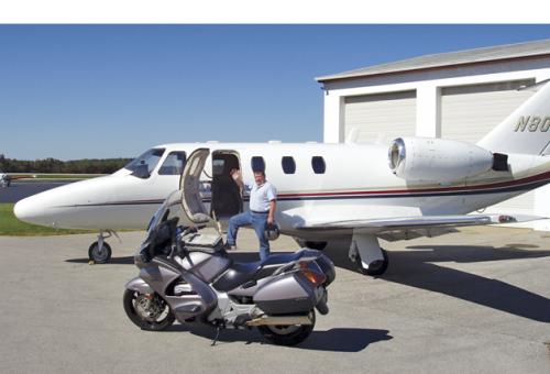 Ride and Fly president John Garwood with a Beechjet charter and his own road 