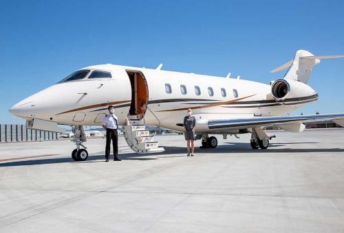 Masked Silver Air flight crew awaiting passengers