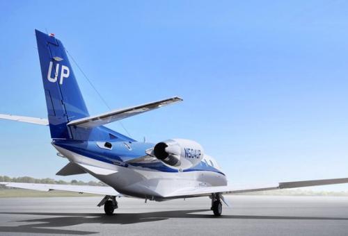 Tail view of Wheels Up Citation Business Jet on airport ramp