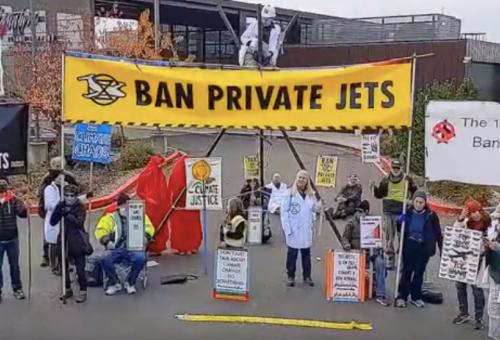 Environmental activists protest at King County International Airport/Boeing Field in Seattle on Nov. 10.