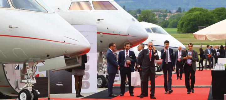 Business jets and people.