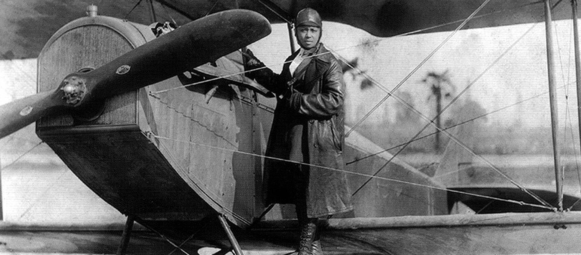 Bessie Coleman and her airplane in 1922