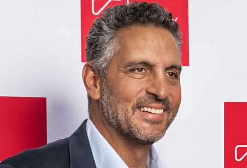 Mauricio Umansky standing in front of The Agency step and repeat banner.