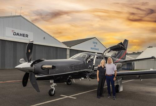 South Florida businessman Johnie Weems and ferry pilot Margrit Waltz pose with Daher TBM 960 at the company's hangar facility in Tarbes, France at sunrise