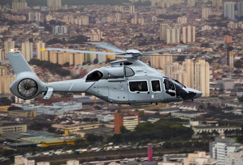 Airbus Helicopters ACH160 in flight over city