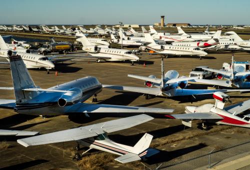 Airport ramp packed with private aircraft